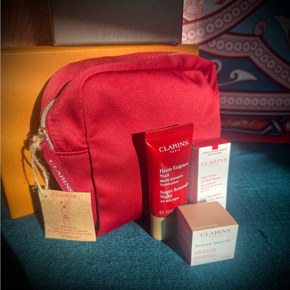 Clarins Vibrant Red Cosmetic Bag with Skincare Essentials